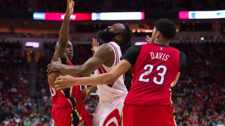 Apr 12, 2015; Houston, TX, USA; New Orleans Pelicans guard Quincy Pondexter (20) and forward Anthony Davis (23) defend against Houston Rockets guard James Harden (13) during the second half at the Toyota Center. The Rockets defeated the Pelicans 121-114. Mandatory Credit: Jerome Miron-USA TODAY Sports