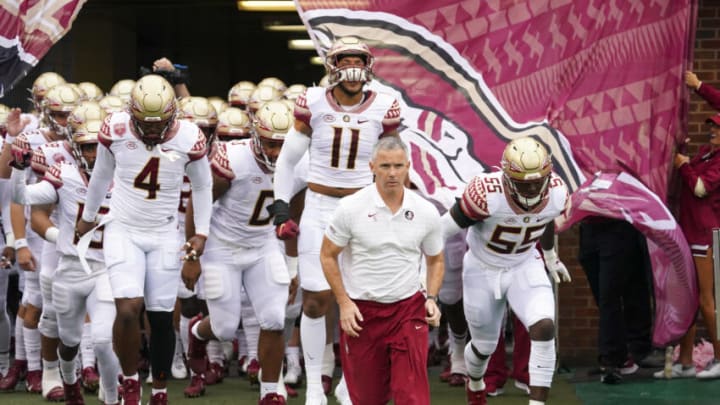 Oct 9, 2021; Chapel Hill, North Carolina, USA; Florida State Seminoles head coach Mike Norvell leads his players out onto the field before the game against the North Carolina Tar Heels at Kenan Memorial Stadium. Mandatory Credit: James Guillory-USA TODAY Sports