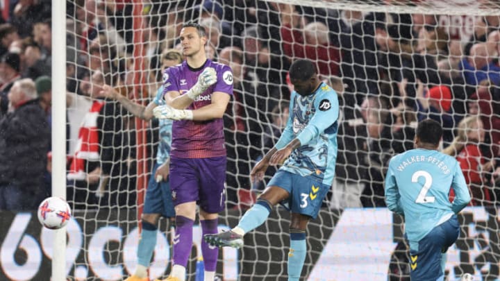 NOTTINGHAM, ENGLAND - MAY 08: Alex Mccarthy, Ainsley Maitland-Niles and Kyle Walker-Peters of Southampton dejected during the Premier League match between Nottingham Forest and Southampton FC at City Ground on May 8, 2023 in Nottingham, United Kingdom. (Photo by James Williamson - AMA/Getty Images)
