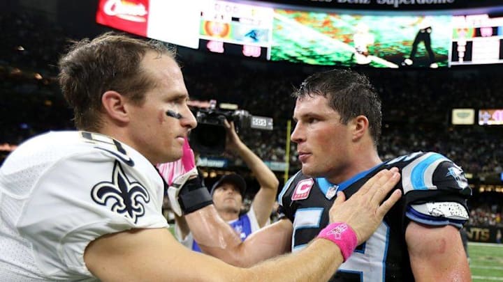 Oct 16, 2016; New Orleans, LA, USA; New Orleans Saints quarterback Drew Brees (9) and Carolina Panthers middle linebacker Luke Kuechly (59) talk after their game at the Mercedes-Benz Superdome. The Saints won 41-38. Mandatory Credit: Chuck Cook-USA TODAY Sports