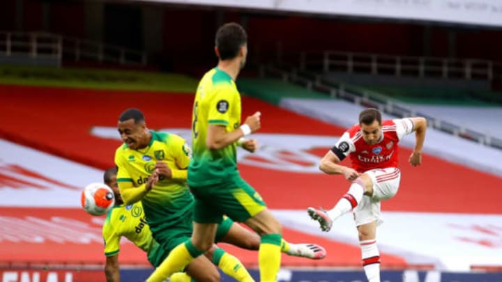 LONDON, ENGLAND – JULY 01: Cedric Soares of Arsenal shoots and scores his team’s fourth goal during the Premier League match between Arsenal FC and Norwich City at Emirates Stadium on July 01, 2020 in London, England. Football Stadiums around Europe remain empty due to the Coronavirus Pandemic as Government social distancing laws prohibit fans inside venues resulting in all fixtures being played behind closed doors. (Photo by Richard Heathcote/Getty Images)