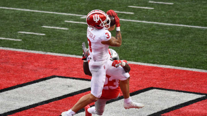 COLUMBUS, OH - NOVEMBER 21: Ty Fryfogle #3 of the Indiana Hoosiers catches a 33-yard touchdown pass as Marcus Hooker #23 of the Ohio State Buckeyes defends in the third quarter at Ohio Stadium on November 21, 2020 in Columbus, Ohio. Ohio State defeated Indiana 42-35. (Photo by Jamie Sabau/Getty Images)