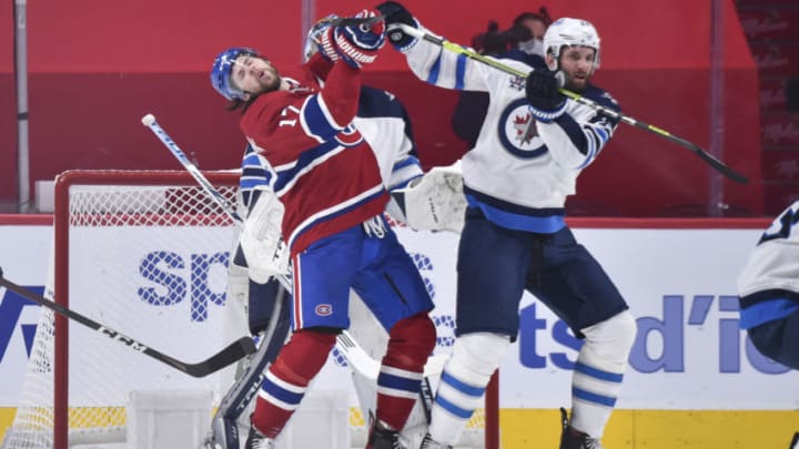 MONTREAL, QC - JUNE 06: Josh Anderson #17 of the Montreal Canadiens and Derek Forbort #24 of the Winnipeg Jets battle for position during the first period in Game Three of the Second Round of the 2021 Stanley Cup Playoffs at the Bell Centre on June 6, 2021 in Montreal, Canada. (Photo by Minas Panagiotakis/Getty Images)