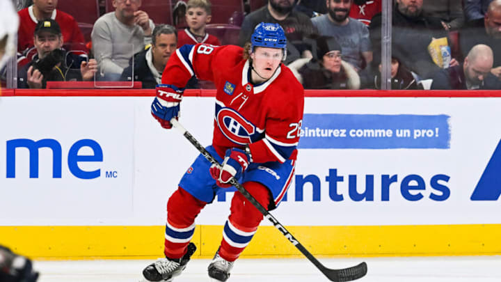 Jan 12, 2023; Montreal, Quebec, CAN; Montreal Canadiens center Christian Dvorak (28) plays the puck against the Nashville Predators during the first period at Bell Centre. Mandatory Credit: David Kirouac-USA TODAY Sports