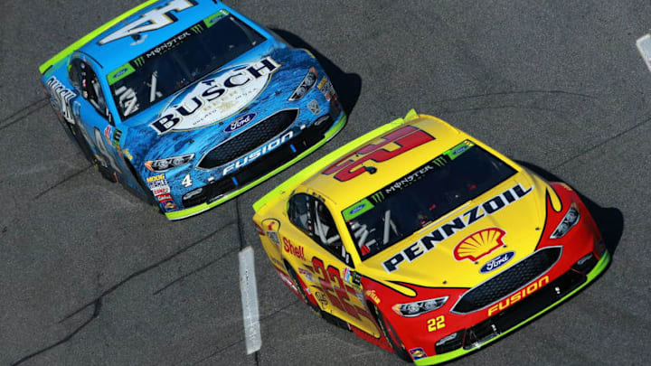 MARTINSVILLE, VA - OCTOBER 28: Joey Logano, driver of the #22 Shell Pennzoil Ford, leads Kevin Harvick, driver of the #4 Busch Beer Ford, during the Monster Energy NASCAR Cup Series First Data 500 at Martinsville Speedway on October 28, 2018 in Martinsville, Virginia. (Photo by Sean Gardner/Getty Images)