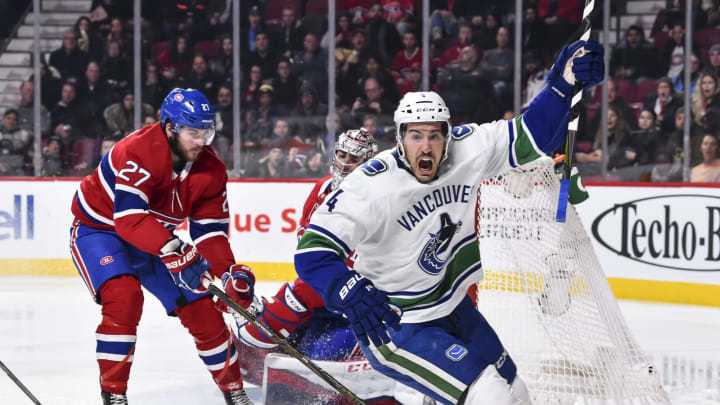 MONTREAL, QC – JANUARY 07: Michael Del Zotto #4 of the Vancouver Canucks reacts after scoring a goal in the third period against the Montreal Canadiens during the NHL game at the Bell Centre on January 7, 2018 in Montreal, Quebec, Canada. The Montreal Canadiens defeated the Vancouver Canucks 5-2. (Photo by Minas Panagiotakis/Getty Images)