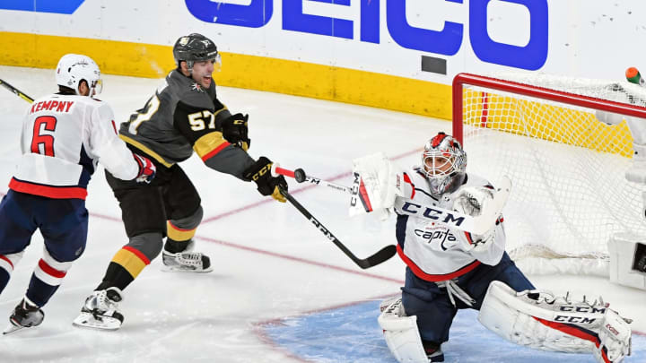 Braden Holtby of the Washington Capitals blocks a shot by Deryk Engelland of the Vegas Golden Knights as Michal Kempny of the Capitals defends against David Perron of the Golden Knights in the second period of Game Two of the 2018 NHL Stanley Cup Final at T-Mobile Arena on May 30, 2018.