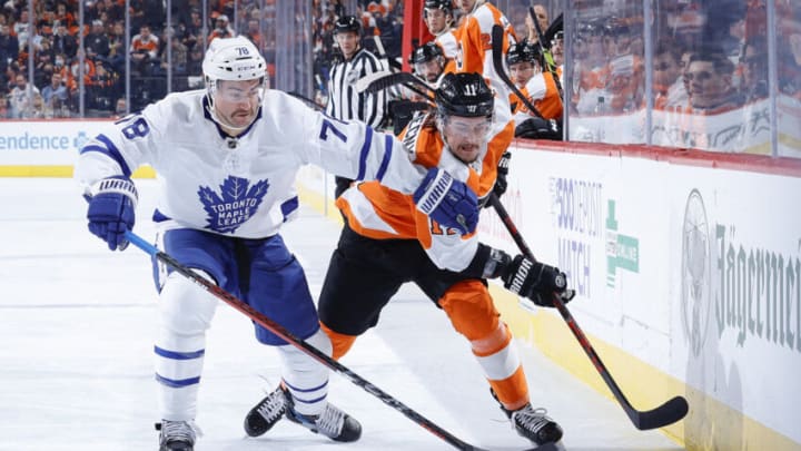 PHILADELPHIA, PENNSYLVANIA - NOVEMBER 10: T.J. Brodie #78 of the Toronto Maple Leafs and Travis Konecny #11 of the Philadelphia Flyers chase the puck at Wells Fargo Center on November 10, 2021 in Philadelphia, Pennsylvania. (Photo by Tim Nwachukwu/Getty Images)