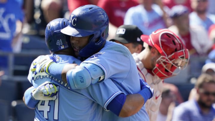 KANSAS CITY, MISSOURI - AUGUST 15: Salvador Perez #13 of the Kansas City Royals hugs Carlos Santana #41 after hitting a two-run home run in the eighth inning against the St. Louis Cardinals at Kauffman Stadium on August 15, 2021 in Kansas City, Missouri. (Photo by Ed Zurga/Getty Images)