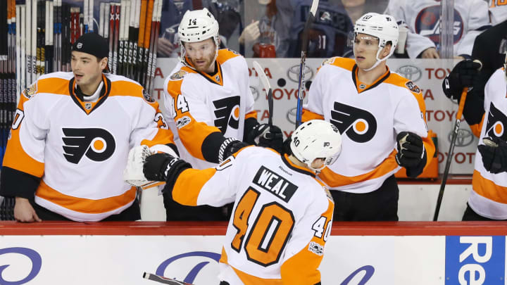 Mar 21, 2017; Winnipeg, Manitoba, CAN; Philadelphia Flyers center Jordan Weal (40) celebrates with teammates on the bench after scoring a goal during the second period against the Winnipeg Jets at MTS Centre. Mandatory Credit: Bruce Fedyck-USA TODAY Sports