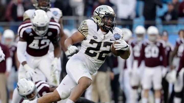 CHARLOTTE, NC – DECEMBER 29: Matt Colburn #22 of the Wake Forest Demon Deacons runs with the ball against the Texas A&M Aggies during the Belk Bowl at Bank of America Stadium on December 29, 2017 in Charlotte, North Carolina. (Photo by Streeter Lecka/Getty Images)