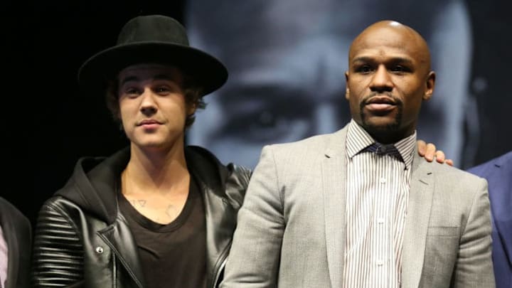 LOS ANGELES, CA - MARCH 11: Justin Bieber appears on stage with Floyd Mayweather Jr.at the Floyd Mayweather v Manny Pacquiao Press Conference on March 11, 2015 in Los Angeles, California. (Photo by Stephen Dunn/Getty Images)