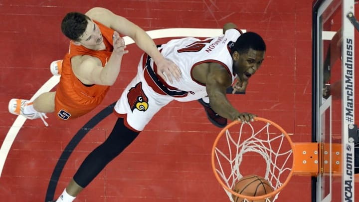 Feb 17, 2016; Louisville, KY, USA; Louisville Cardinals forward Jaylen Johnson (10) dunks against Syracuse Orange forward Tyler Lydon (20) during the second half at KFC Yum! Center. Louisville defeated Syracuse 72-58. Mandatory Credit: Jamie Rhodes-USA TODAY Sports