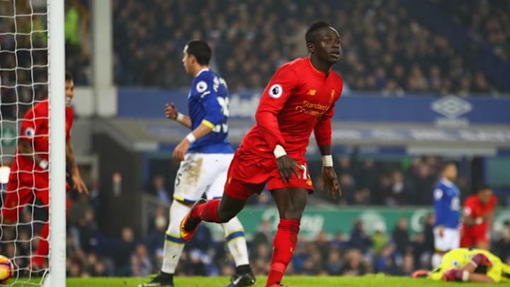 LIVERPOOL, ENGLAND - DECEMBER 19: Sadio Mane of Liverpool celebrates as he scores their first goal during the Premier League match between Everton and Liverpool at Goodison Park on December 19, 2016 in Liverpool, England. (Photo by Clive Brunskill/Getty Images)