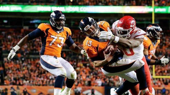Nov 27, 2016; Denver, CO, USA; Kansas City Chiefs outside linebacker Justin Houston (50) forces a fumble against Denver Broncos quarterback Trevor Siemian (13) in the second quarter at Sports Authority Field at Mile High. Mandatory Credit: Isaiah J. Downing-USA TODAY Sports