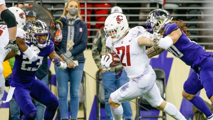 Nov 26, 2021; Seattle, Washington, USA; Washington State Cougars running back Max Borghi (21) rushes for a touchdown against the Washington Huskies during the first quarter at Alaska Airlines Field at Husky Stadium. Mandatory Credit: Joe Nicholson-USA TODAY Sports
