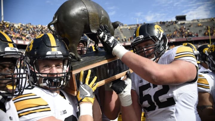 MINNEAPOLIS, MN - OCTOBER 8: Iowa celebrate a win of the game against Minnesota with Floyd of Rosedale Trophy on October 8, 2016 at TCF Bank Stadium in Minneapolis, Minnesota. Iowa defeated Minnesota 14-7. (Photo by Hannah Foslien/Getty Images)