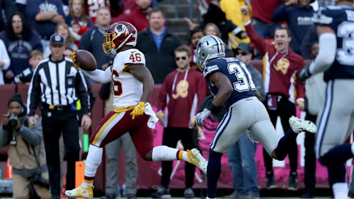LANDOVER, MD - OCTOBER 21: Kapri Bibbs #46 of the Washington Redskins runs past Byron Jones #31 of the Dallas Cowboys for a touchdown during the first half at FedExField on October 21, 2018 in Landover, Maryland. (Photo by Will Newton/Getty Images)