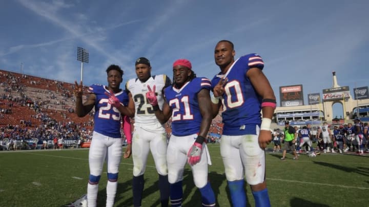 Oct 9, 2016; Los Angeles, CA, USA; Southern California Trojans former players, Buffalo Bills cornerback Kevon Seymour (29), Los Angeles Rams strong safety T.J. McDonald (25), Buffalo Bills defensive back Nickell Robey (21) and Buffalo Bills wide receiver Robert Woods (10), pose after a NFL game at Los Angeles Memorial Coliseum. The Bills defeated the Rams 30-19. Mandatory Credit: Kirby Lee-USA TODAY Sports