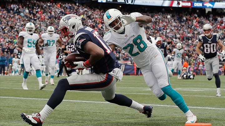 Oct 27, 2013; Foxborough, MA, USA; New England Patriots wide receiver Aaron Dobson (17) catches a touchdown pass past Miami Dolphins cornerback Nolan Carroll (28) during the third quarter at Gillette Stadium. Mandatory Credit: Winslow Townson-USA TODAY Sports
