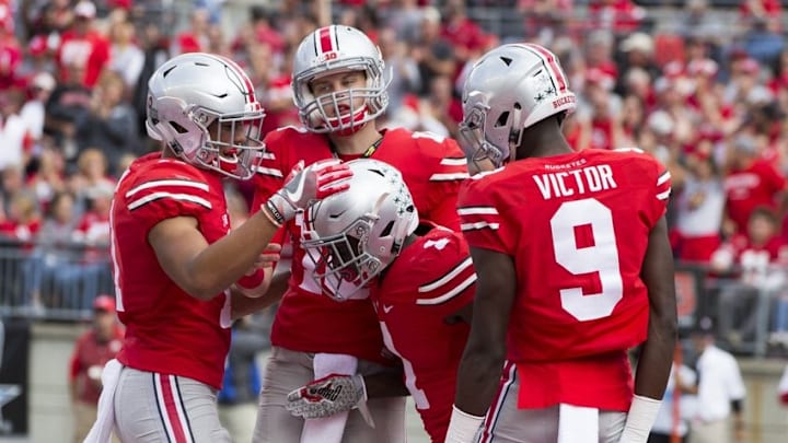 Oct 1, 2016; Columbus, OH, USA; Ohio State Buckeyes wide receiver Johnnie Dixon (1) is congratulated by teamates after a fourth quarter touchdown against the Rutgers Scarlet Knights at Ohio Stadium. Ohio State won the game 58-0. Mandatory Credit: Greg Bartram-USA TODAY Sports
