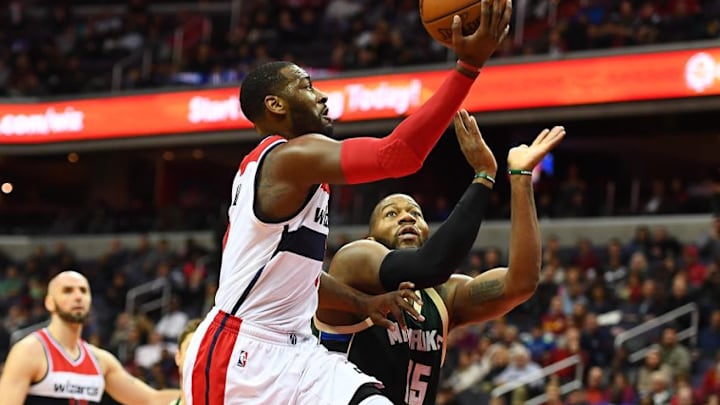 Dec 10, 2016; Washington, DC, USA; Washington Wizards guard John Wall (2) shoots over Milwaukee Bucks center Greg Monroe (15) during the second half at Verizon Center. Washington Wizards won 110-105. Mandatory Credit: Brad Mills-USA TODAY Sports