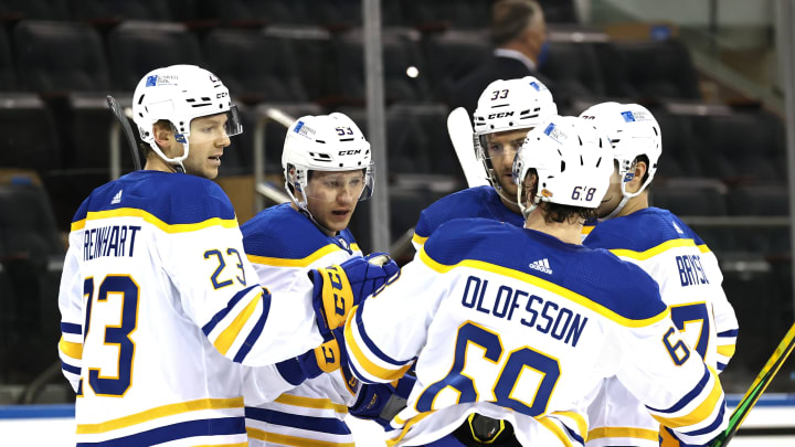 Apr 25, 2021; New York, New York, USA; Jeff Skinner #53 of the Buffalo Sabres is congratulated by teammates Sam Reinhart #23,Victor Olofsson #68 and Colin Miller #33 after he scored in the first period against the New York Rangers at Madison Square Garden on April 25, 2021 in New York City. Mandatory Credit: Elsa/Pool Photo-USA TODAY Sports
