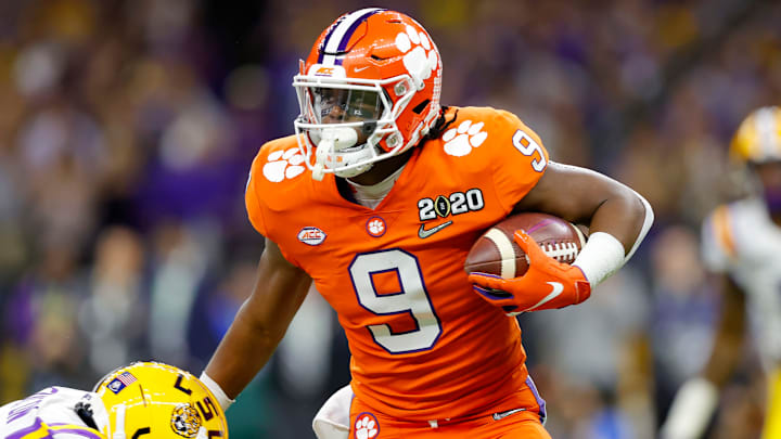 NEW ORLEANS, LOUISIANA – JANUARY 13: Travis Etienne #9 of the Clemson Tigers runs the ball against Derion Kendrick #1 of the Clemson Tigers during the first quarter in the College Football Playoff National Championship game at Mercedes Benz Superdome on January 13, 2020 in New Orleans, Louisiana. (Photo by Kevin C. Cox/Getty Images)