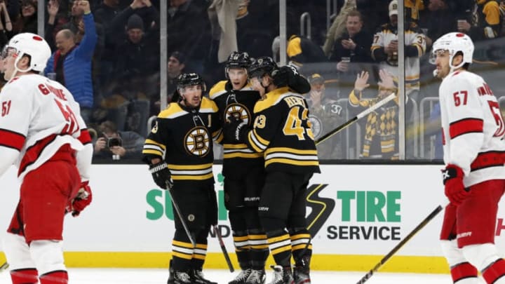 BOSTON, MA - DECEMBER 03: The Bruins celebrate the goal from Boston Bruins center Charlie Coyle (13) during a game between the Boston Bruins and the Carolina Hurricanes on December 3, 2019, at TD garden in Boston, Massachusetts. (Photo by Fred Kfoury III/Icon Sportswire via Getty Images)