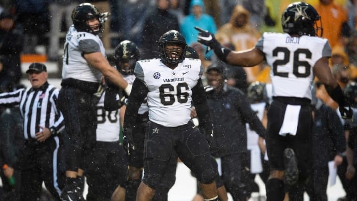 Vanderbilt defensive lineman Cameron Robinson (66) celebrates a play with Vanderbilt defensive lineman Drew Birchmeier (91) and Vanderbilt safety Anfernee Orji (26) during a game between Tennessee and Vanderbilt at Neyland Stadium in Knoxville, Tenn. on Saturday, Nov. 30, 2019.Utvs Vandy1130