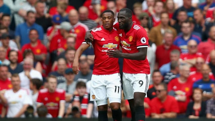 MANCHESTER, ENGLAND - AUGUST 13: Anthony Martial of Manchester United celebrates scoring his sides third goal with Romelu Lukaku.