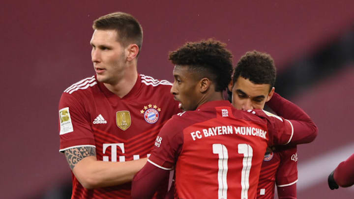 MUNICH, GERMANY - DECEMBER 11: Jamal Musiala celebrates scoring his team's second goal with Niklas Süle and Kingsley Coman of Muenchen during the Bundesliga match between FC Bayern München and 1. FSV Mainz 05 at Allianz Arena on December 11, 2021 in Munich, Germany. (Photo by Sebastian Widmann/Getty Images)