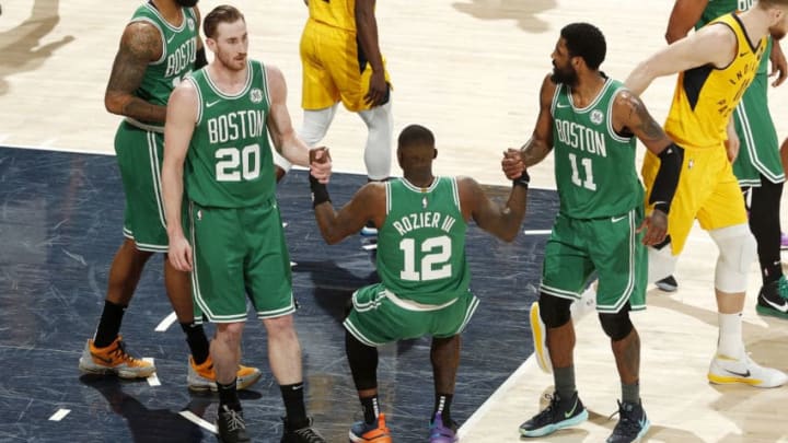 INDIANAPOLIS, IN - APRIL 19: Gordon Hayward #20 and Kyrie Irving #11 help up Terry Rozier #12 of the Boston Celtics during Game Three of Round One of the 2019 NBA Playoffs against the Indiana Pacers on April 19, 2019 at Bankers Life Fieldhouse in Indianapolis, Indiana. NOTE TO USER: User expressly acknowledges and agrees that, by downloading and/or using this photograph, user is consenting to the terms and conditions of the Getty Images License Agreement. Mandatory Copyright Notice: Copyright 2019 NBAE (Photo by Jeff Haynes/NBAE via Getty Images)