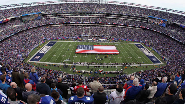 EAST RUTHERFORD, NJ - JANUARY 08: A general view of a giant American Flag stretched across the field during the performcance of the National Anthem prior to the New York Giants hosting the Atlanta Falcons during their NFC Wild Card Playoff game at MetLife Stadium on January 8, 2012 in East Rutherford, New Jersey. (Photo by Nick Laham/Getty Images)
