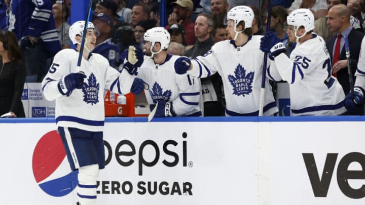 May 6, 2022; Tampa, Florida, USA; Toronto Maple Leafs right wing Ilya Mikheyev (65) is congratulated by teammates as he scores a goal during the third period of game three of the first round of the 2022 Stanley Cup Playoffs against the Tampa Bay Lightning at Amalie Arena. Mandatory Credit: Kim Klement-USA TODAY Sports