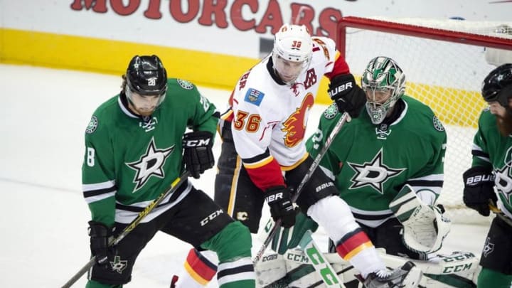 Dec 6, 2016; Dallas, TX, USA; Dallas Stars defenseman Stephen Johns (28) and goalie Kari Lehtonen (32) defend against Calgary Flames right wing Troy Brouwer (36) during the first period at the American Airlines Center. Mandatory Credit: Jerome Miron-USA TODAY Sports