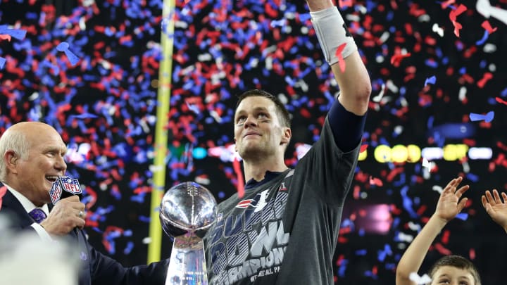 Feb 5, 2017; Houston, TX, USA; New England Patriots quarterback Tom Brady (12) celebrates with the Vince Lombardi Trophy after beating the Atlanta Falcons during Super Bowl LI at NRG Stadium. Mandatory Credit: Matthew Emmons-USA TODAY Sports