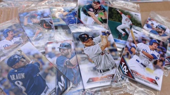 DETROIT, MI - AUGUST 12: A group of Topps baseball card packs wait to be given out to fans to celebrate National Baseball Card Day prior to the game between the Detroit Tigers and the Minnesota Twins at Comerica Park on August 12, 2017 in Detroit, Michigan. The Tigers defeated the Twins 12-11. (Photo by Mark Cunningham/MLB Photos via Getty Images)