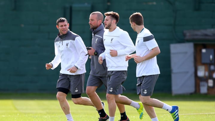 LIVERPOOL, ENGLAND – APRIL 13: James Milner of Liverpool (L), Adam Lallana of Liverpool (2R) and Jon Flanagan of Liverpool warm up during a training session ahead of the UEFA Europa League quarter final between Liverpool and Borussia Dortmund at Melwood Training Ground on April 13, 2016 in Liverpool, England. (Photo by Dave Thompson/Getty Images)