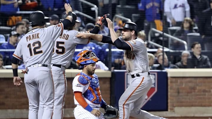 Oct 5, 2016; New York City, NY, USA; San Francisco Giants third baseman Conor Gillaspie (21) celebrates with second baseman Joe Panik (12) and shortstop Brandon Crawford (35) after hitting a three run home run during the ninth inning against the New York Mets in the National League wild card playoff baseball game at Citi Field. Mandatory Credit: Anthony Gruppuso-USA TODAY Sports