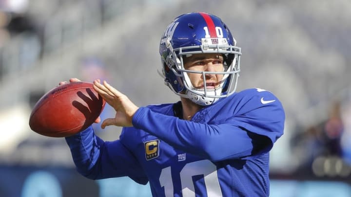 Dec 20, 2015; East Rutherford, NJ, USA; New York Giants quarterback Eli Manning (10) warming up prior to the game against the Carolina Panthers at MetLife Stadium. Mandatory Credit: Jim O