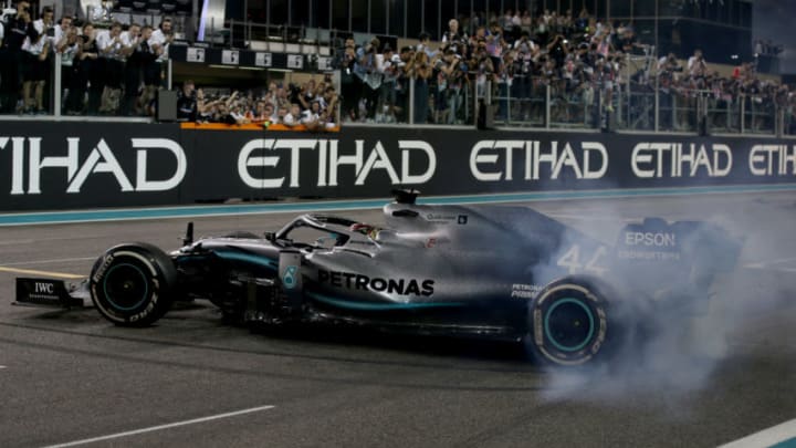ABU DHABI, UNITED ARAB EMIRATES - DECEMBER 01: Race winner Lewis Hamilton of Great Britain and Mercedes GP celebrates with donuts on track during the F1 Grand Prix of Abu Dhabi at Yas Marina Circuit on December 01, 2019 in Abu Dhabi, United Arab Emirates. (Photo by Charles Coates/Getty Images)