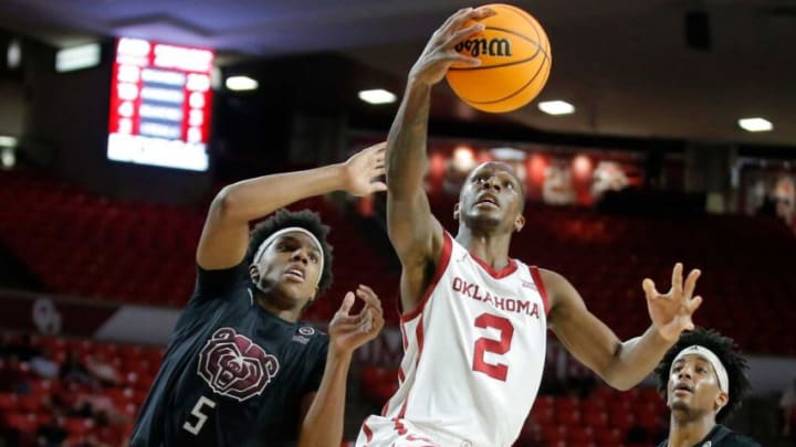Oklahoma Sooners guard Umoja Gibson (2) goes to the basket beside Missouri State Bears guard Donovan Clay (5) during an NIT basketball game between at the University of Oklahoma Sooners (OU) and the Missouri State Bears at Lloyd Noble Center in Norman, Okla., Tuesday, March 15, 2022. Oklahoma won 89-72.Ou Nit Basketball