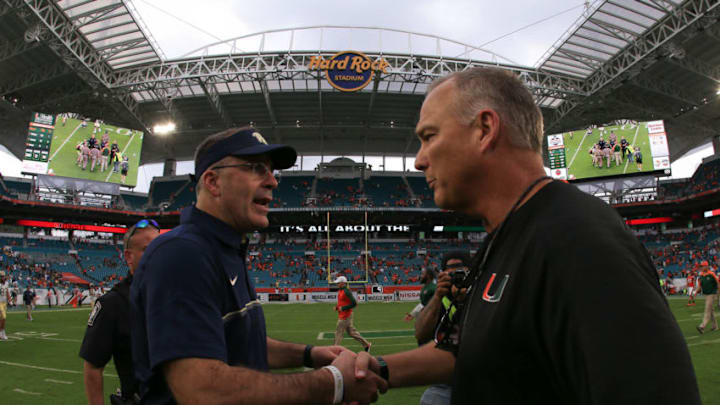 MIAMI GARDENS, FL - NOVEMBER 05: Head coaches Pat Narduzzi of the Pittsburgh Panthers and Mark Richt of the Miami Hurricanes shake hands after the game at Hard Rock Stadium on November 5, 2016 in Miami Gardens, Florida. (Photo by Rob Foldy/Getty Images)