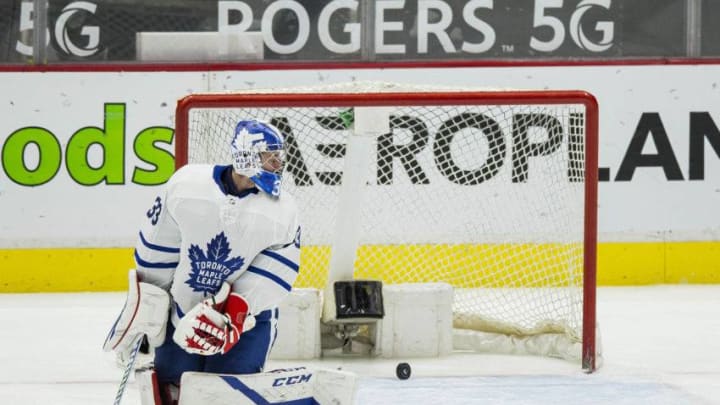 Apr 20, 2021; Vancouver, British Columbia, CAN; Toronto Maple Leafs goalie David Rittich (33) looks at the puck shot from Vancouver Canucks forward Nils Hoglander (36) go past him in the third period at Rogers Arena. Canucks won 6-3. Mandatory Credit: Bob Frid-USA TODAY Sports
