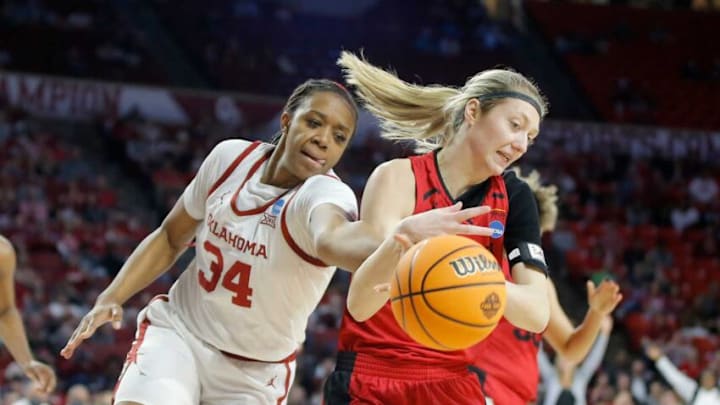 Oklahoma's Liz Scott (34) reaches for the ball beside IUPUI's Natalie Andersen (24) during a women's basketball game between the University of Oklahoma Sooners (OU) and IUPUI in the first round of the NCAA Tournament at Lloyd Noble Center in Norman, Okla., Saturday, March 19, 2022. Oklahoma won 78-72.Women S Ncaa Tournament