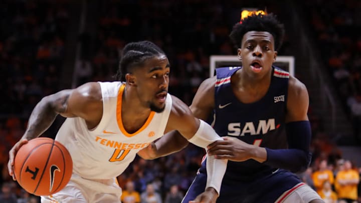 KNOXVILLE, TN - DECEMBER 19: Jordan Bone #0 of the Tennessee Volunteers drives past Kevion Nolan #1 of the Samford Bulldogs defending during the first half of their game at Thompson-Boling Arena on December 19, 2018 in Knoxville, Tennessee. (Photo by Donald Page/Getty Images)