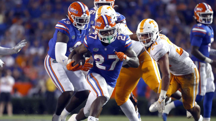 Sep 25, 2021; Gainesville, Florida, USA;Florida Gators running back Dameon Pierce (27) runs with the ball against the Tennessee Volunteers during the fourth quarter at Ben Hill Griffin Stadium. Mandatory Credit: Kim Klement-USA TODAY Sports