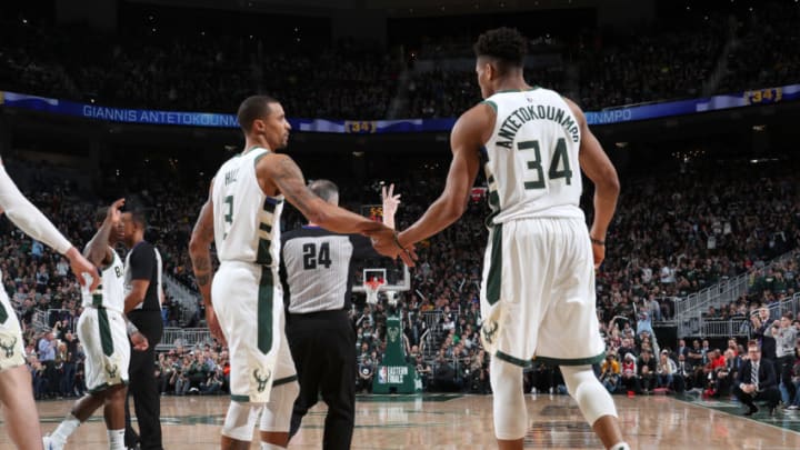 MILWAUKEE, WI - MAY 17: George Hill #3 and Giannis Antetokounmpo #34 of the Milwaukee Bucks high five during Game Two of the Eastern Conference Finals against the Toronto Raptors on May 17, 2019 at the Fiserv Forum in Milwaukee, Wisconsin. NOTE TO USER: User expressly acknowledges and agrees that, by downloading and/or using this photograph, user is consenting to the terms and conditions of the Getty Images License Agreement. Mandatory Copyright Notice: Copyright 2019 NBAE (Photo by Nathaniel S. Butler/NBAE via Getty Images)