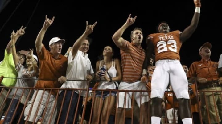 Sep 4, 2016; Austin, TX, USA; Texas Longhorns linebacker Jeffrey McCulloch (23) celebrates the victory against the Notre Dame Fighting Irish with fans at Darrell K Royal-Texas Memorial Stadium. Mandatory Credit: Kevin Jairaj-USA TODAY Sports